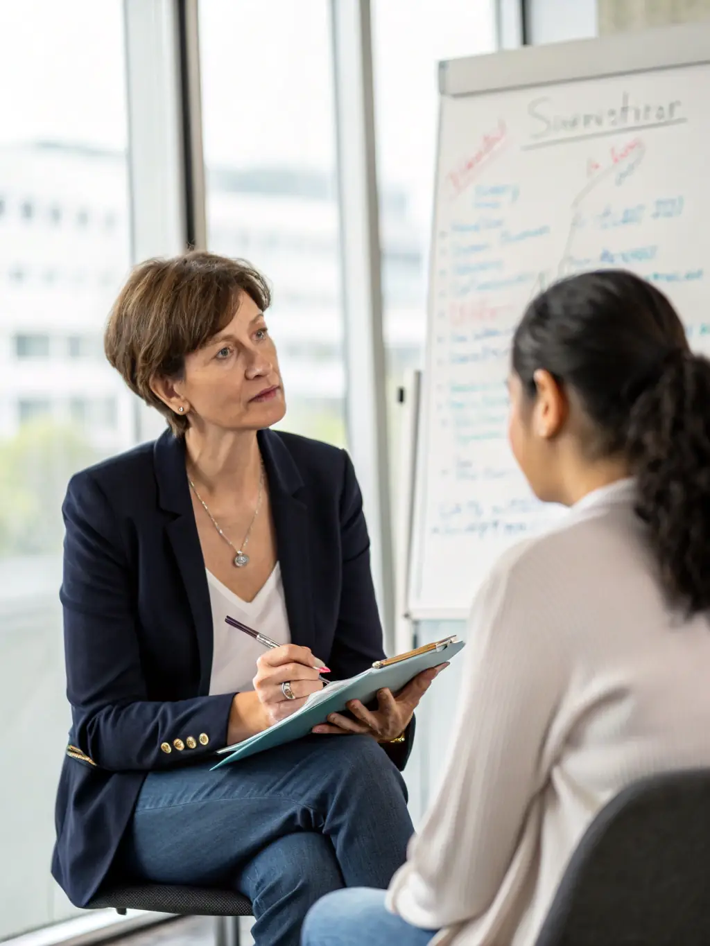 A coach providing constructive feedback to a business owner, fostering continuous improvement and professional development.