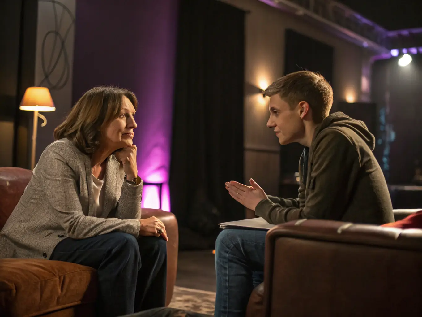 A coach working with a client in a modern office setting, reviewing financial reports and discussing strategies for improving profitability.